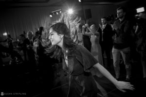 A woman dancing on the dance floor at a wedding at Alfond Inn.