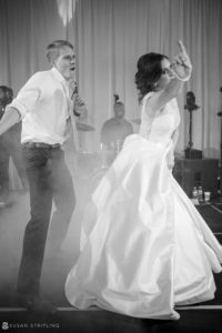 A bride and groom dancing at their wedding reception at the Alfond Inn.