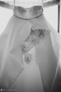 A black and white winter wedding dress with roses on it at Front and Palmer.