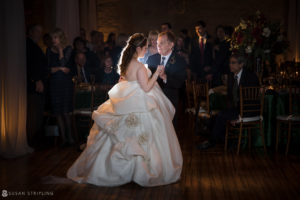 A bride and groom sharing their first dance at a Front and Palmer winter wedding reception.