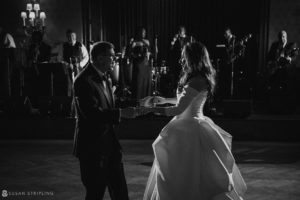 A wedding bride and groom sharing their first dance in black and white at Philly's Union League.