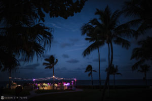 A wedding reception at night with palm trees at the Ocean Club in the Bahamas.