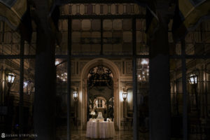 A Vizcaya wedding reception in an ornate building at night for a vow renewal.