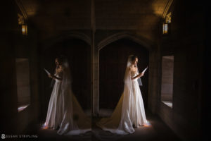 A Nassau Inn bride in a wedding dress standing in a mirror.