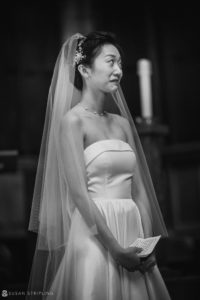 A bride in a wedding dress standing at the Nassau Inn for her wedding ceremony.