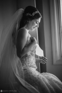 Black and white photo of a bride getting ready at Florentine Gardens Estate.