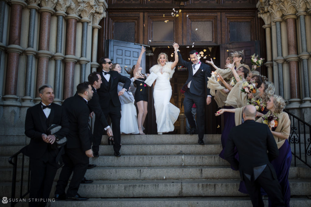rose petal toss on church steps after wedding ceremony philly