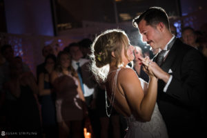 A bride and groom sharing their first dance at their wedding reception held at Loews Hotel Philly.