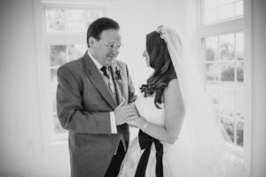 A black and white photo of a wedding bride and her father at the St. Regis.