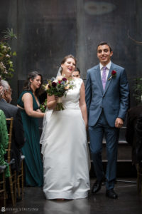 A wedding couple walking down the aisle at a Foundry wedding.