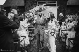 A bride and groom walking down the aisle at a Stonover Farm wedding.