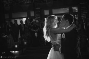 A bride and groom sharing their first dance at the Botanical Gardens in New York during their wedding night.