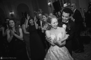 A bride and groom dancing at a Yale Club wedding reception.