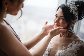 A bride is getting her hair done at Four Seasons Hotel Philadelphia at Comcast Center Wedding, captured by a wedding photographer.