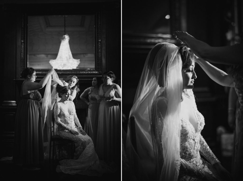 A bride getting ready for her wedding in front of a mirror at Capitale, NYC.