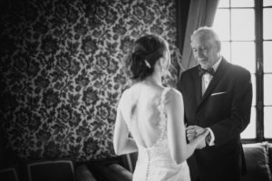 A black and white photo of a bride and her father at their summer wedding at Bourne Mansion.