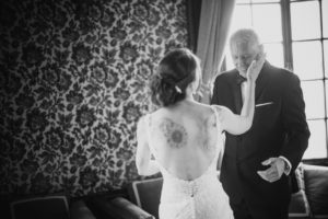 A black and white photo of a bride and her father at their summer wedding at Bourne Mansion.