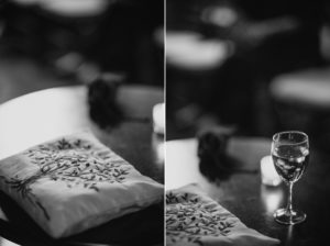 A black and white photo of a wine glass on a table at Bourne Mansion.