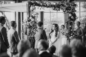 A black and white photo of Wallace and the Loeb Boathouse, capturing their wedding ceremony.