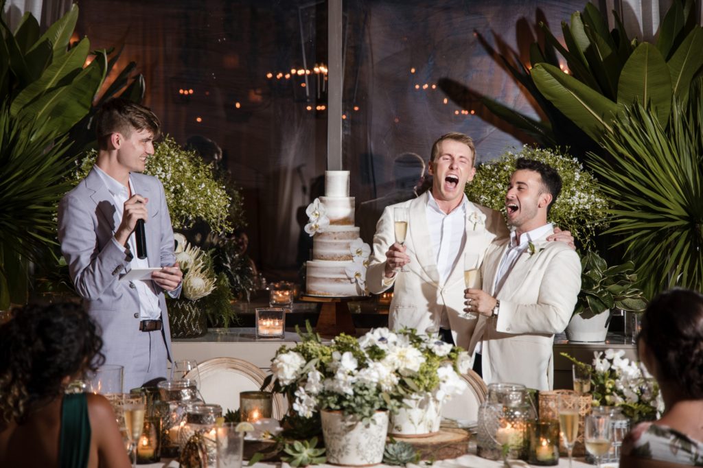 A group of men are singing at a wedding reception at the Ritz Carlton in Dorado Beach.