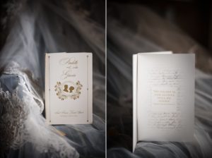 A wedding program and a veil from St. Francis Xavier- a beautiful ceremony held at the Yale Club venue, elegantly displayed on a bed.