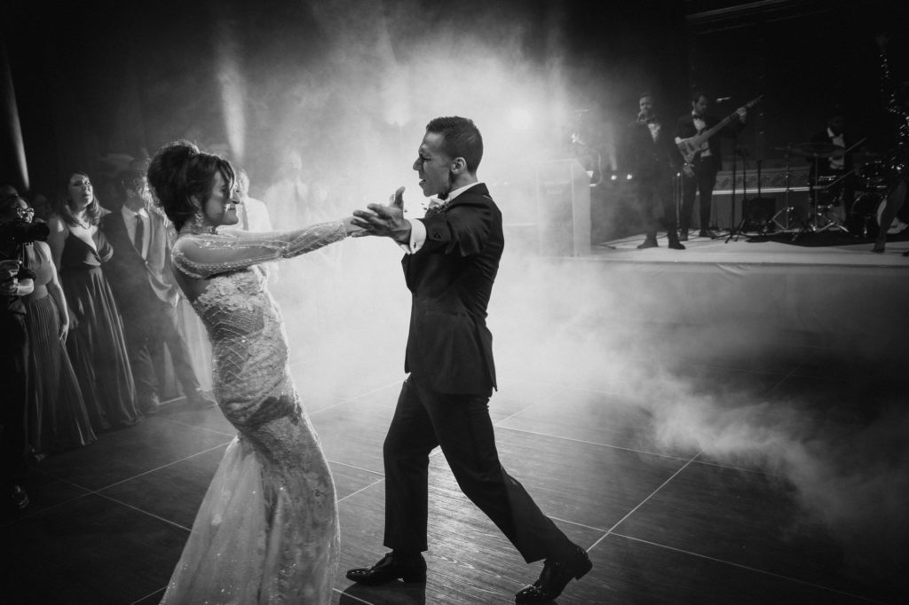 A bride and groom gracefully dancing at their elegant wedding reception held at Capitale in NYC.