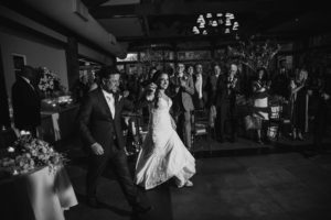 Wallace and Loeb Boathouse wedding ceremony as the bride and groom gracefully walk down the aisle.