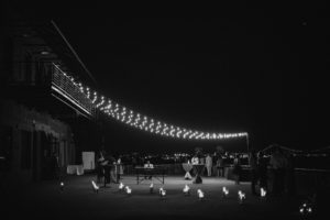 A black and white photo of a summer wedding at Liberty Warehouse, taken at night.