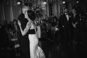 A couple shares their first dance at a summer wedding at the Bourne Mansion.