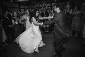 Wallace and the Loeb Boathouse wedding - A bride and groom dancing in front of a crowd at their wedding celebration held at the Wallace and the Loeb Boathouse.