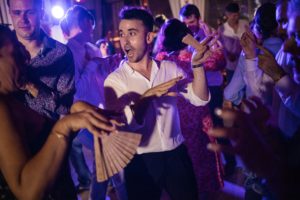 A group of people dancing at a wedding party held at the Dorado Beach.