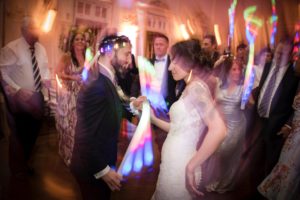 A bride and groom dancing at their summer wedding reception at Bourne Mansion.