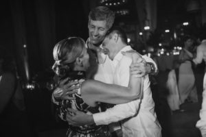 Two people hugging on the dance floor at a wedding at the Dorado Beach, Ritz Carlton.