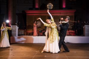 A man and a woman performing an elegant dance on a wedding stage in Capitale, NYC.