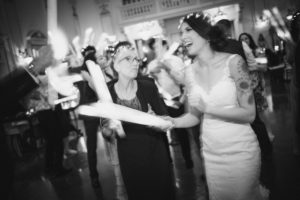 A bride and groom dancing at a summer wedding in a black and white photo at Bourne Mansion.