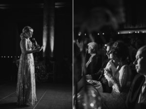 A black and white photo of a bride giving a speech at a wedding in NYC.