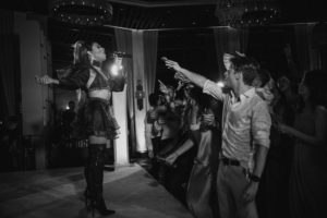 Black and white photo of a woman dancing on a stage at the Ritz Carlton.