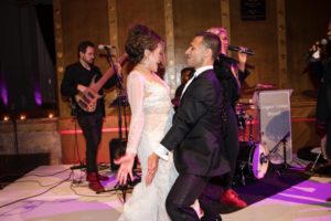 A bride and groom dancing onstage at a wedding in Capitale, NYC.