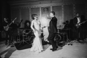 A bride and groom dancing at their wedding in NYC.