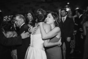 A bride and groom hugging on the dance floor at their Gotham Hall wedding.