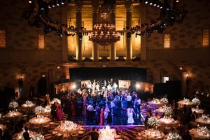 An aerial view of a Gotham Hall wedding reception in a large ballroom.