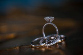 A wedding ring sits atop another ring in the beautiful venue of 501 Union, located in Brooklyn.