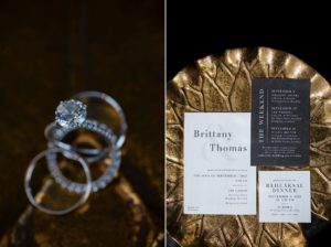 A Brooklyn wedding invitation rests gracefully on a gold plate, beside an exquisite wedding ring.