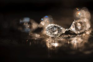 A close up of diamonds on a dark surface in New York.