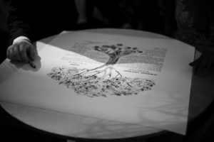 A black and white photo of a tree drawing on a table at the 74 Wythe wedding.