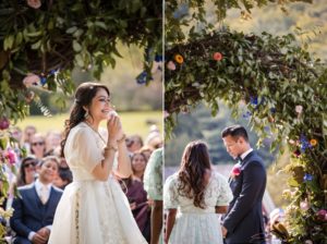 A bride and groom smiling at each other during their Riverside Farm wedding ceremony.