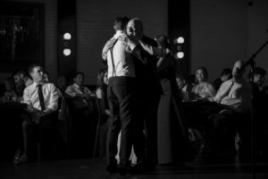 A man and woman hugging at a Brooklyn wedding reception at 501 Union.
