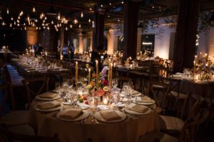 A New York wedding reception set up with tables and candles.