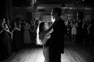 A bride and groom sharing their first dance at a New York City wedding.
