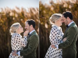 A bride and groom embrace in front of tall reeds during their wedding in New York.
